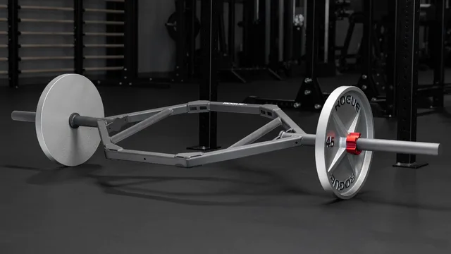 Rogue TB-1 Trap Bar 2.0 with a closed frame and example plates in a gym